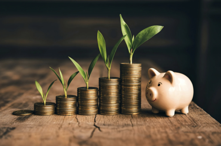 Stacks of coins with green sprouts growing beside a pink piggy bank symbolizing savings and business growth